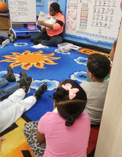 Story time during Reading for the Record at Luminous.